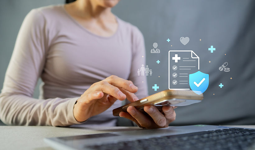 Woman using smartphone for health insurance application and digital medical document with virtual icons