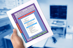 Digital tablet showing medical record code searching on screen. 