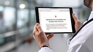 Male doctor physician medical worker holding digital tablet in hands looking at white blank empty mockup screen working in hospital. E health technology mock up concept. Over . Heruntergeladen Male doctor physician medical worker holding digital tablet in hands looking at white blank empty mockup screen working in hospital. E health technology mock up concept. 