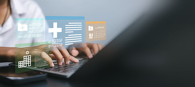 Close up of hands typing on laptop with digital healthcare interface displaying patient records, medical data analysis, and hospital building icons for modern health technology concept.
