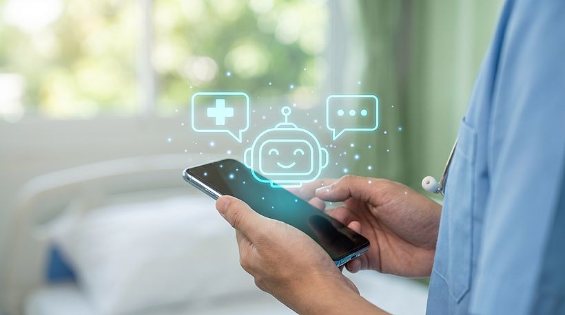 Doctor using phone with medical chatbot interface